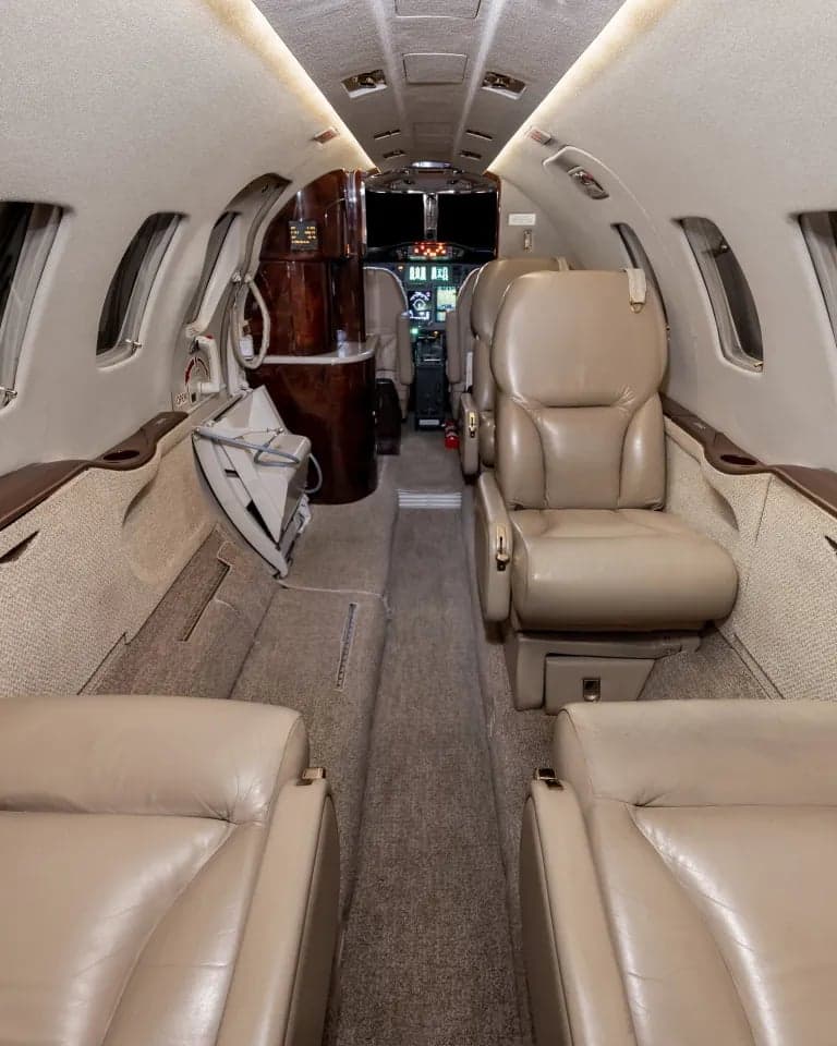Full view of the aircraft interior showing the cockpit, seats, and refreshment center.