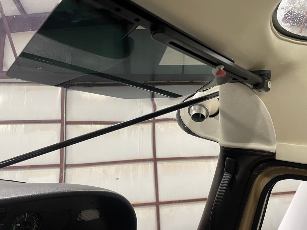 Close-up of the sun visor in the Cessna 185 Skywagon cockpit.