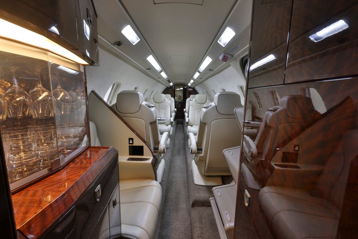 Interior view of the aircraft with a bar and seating.