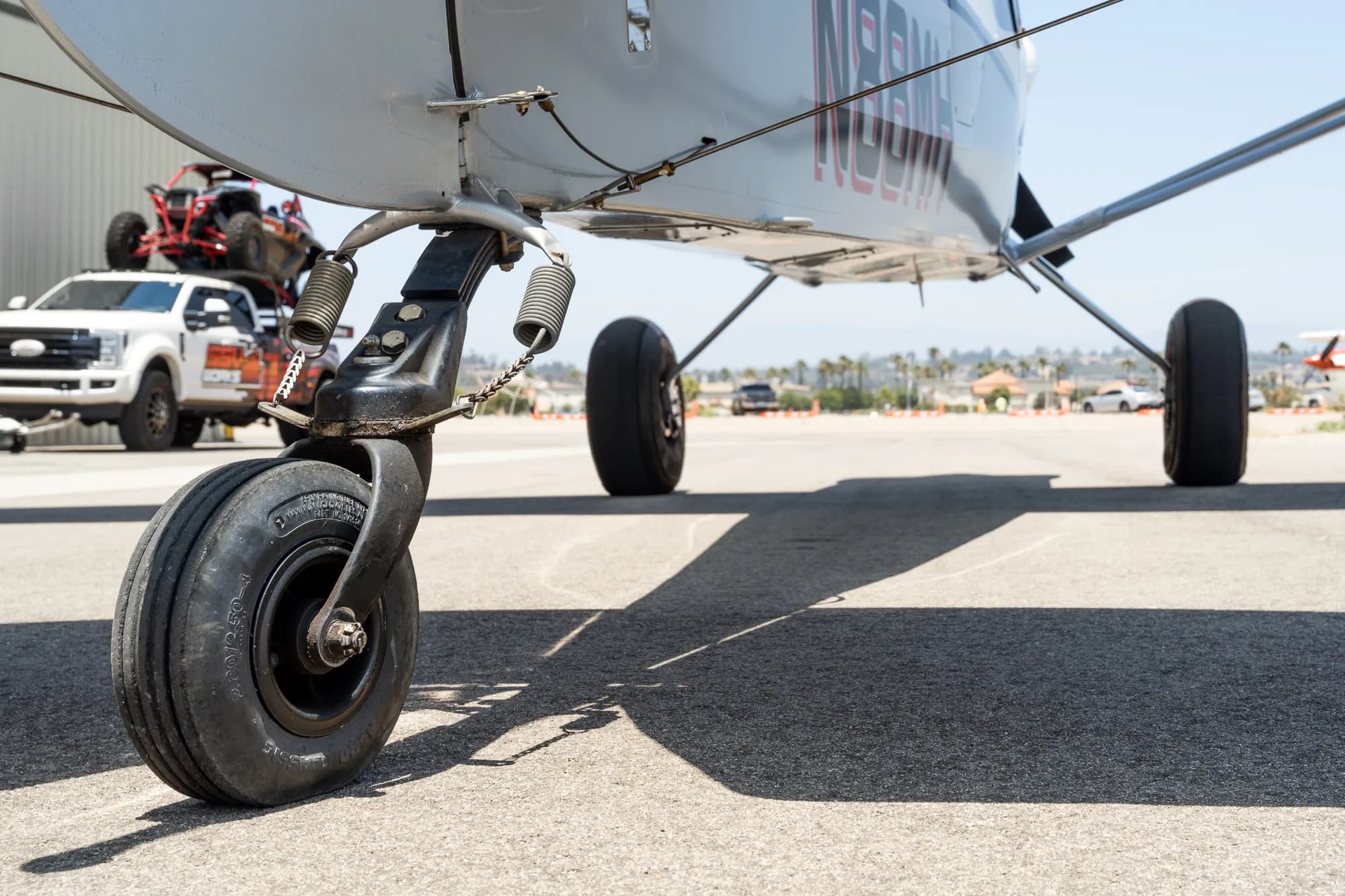 Close up of the landing gear and underside of a CubCrafters XCub aircraft.