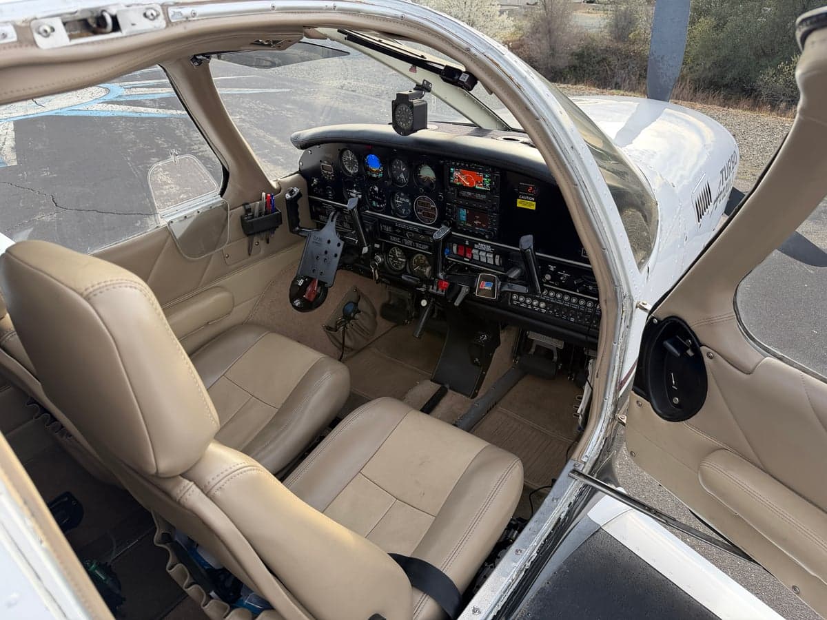 View of the cockpit and cabin seats from outside the aircraft.