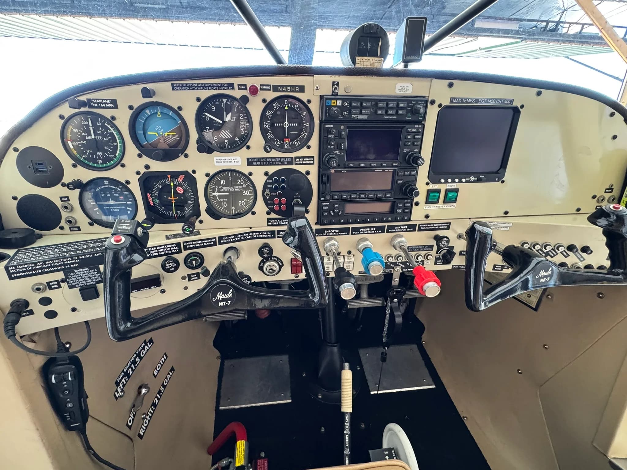 Full view of the aircraft's instrument panel with dual yokes and various gauges.