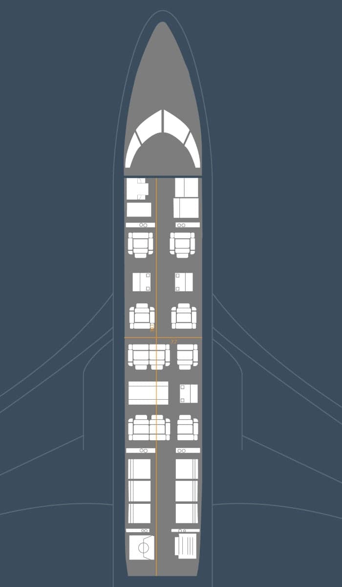 A close-up of the aircraft's lavatory, featuring wood cabinetry and a gold sink.