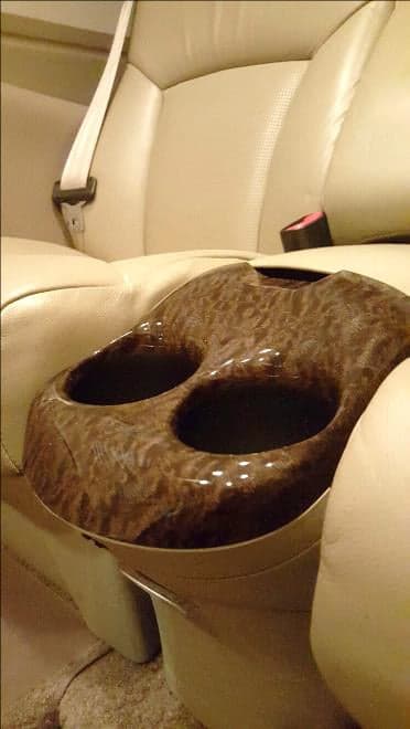 A cup holder in the aircraft cabin.