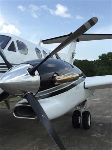 Close-up of the King Air aircraft's propeller and engine nacelle.