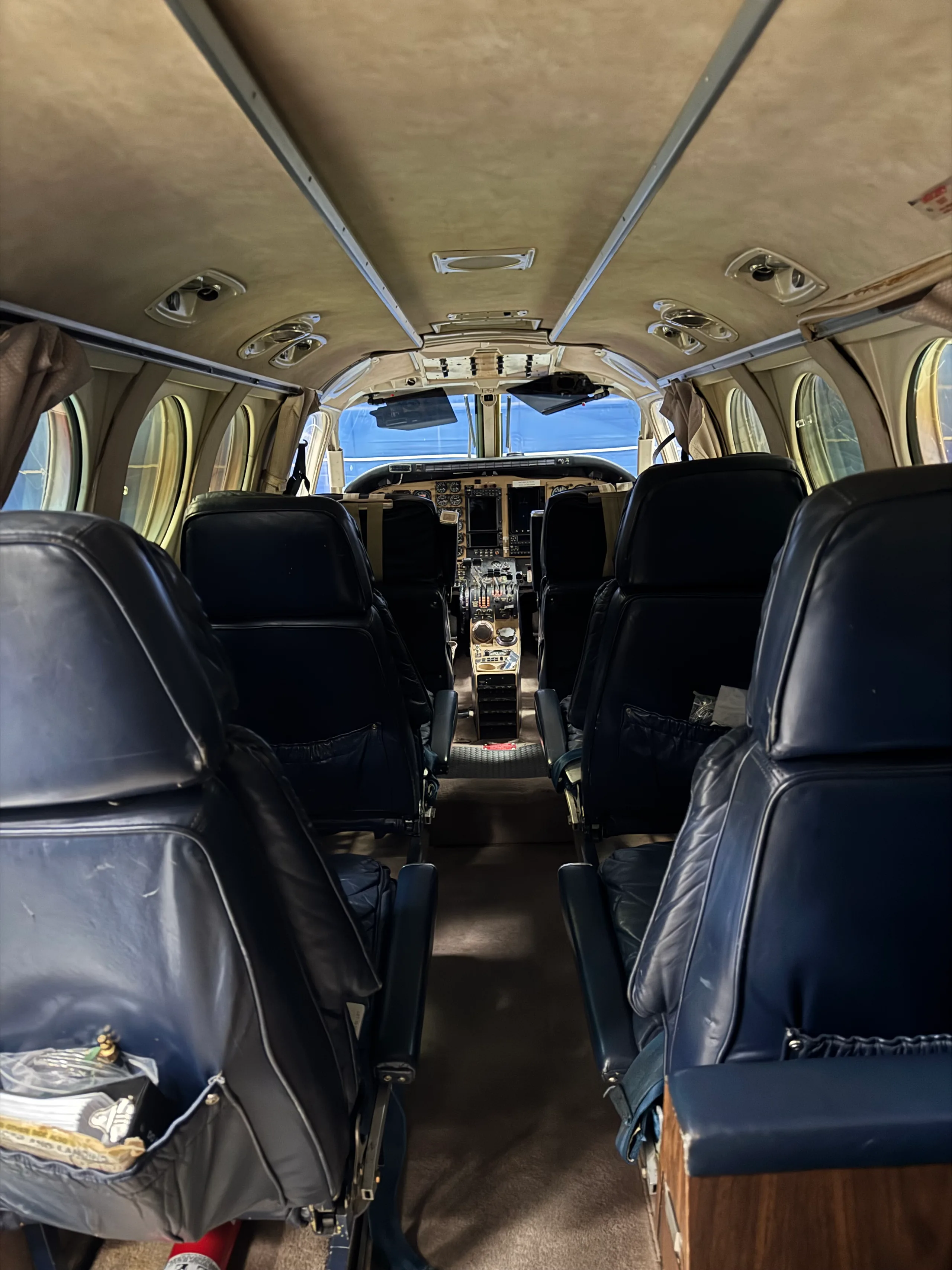 View from the rear of the aircraft cabin towards the cockpit.