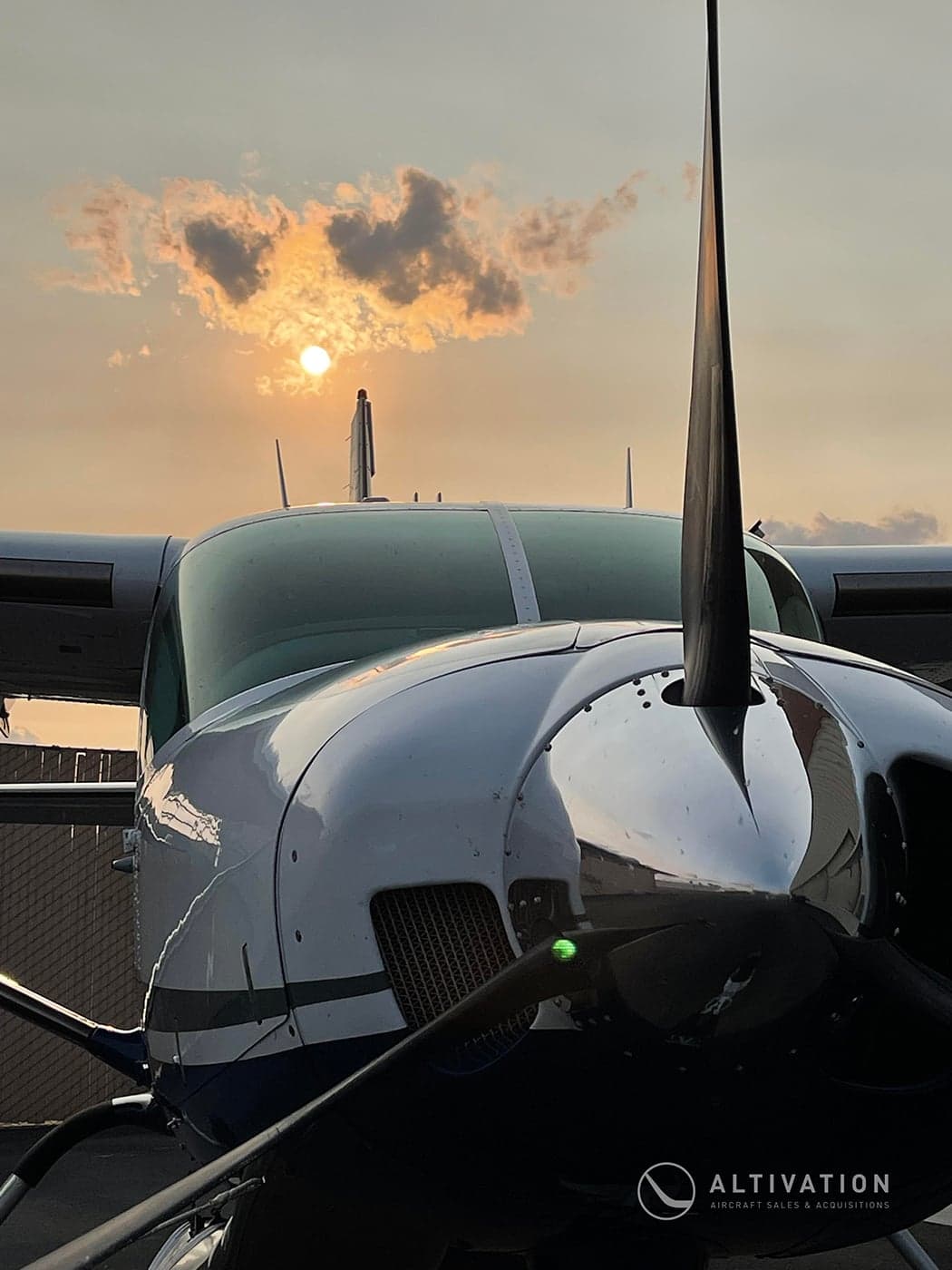 Cessna 208 Caravan, registration N249TG, parked on the tarmac with other aircraft in the background.
