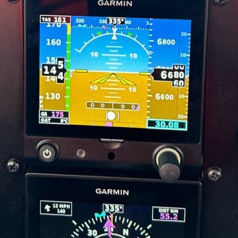 Close-up of the Garmin avionics display in the cockpit of an aircraft.