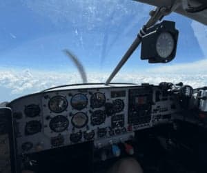 View of the instrument panel from inside the aircraft in flight.