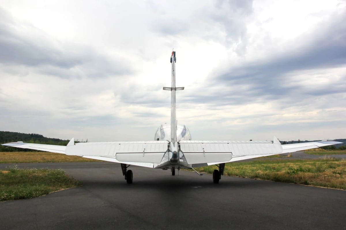 Rear view of N225CR Beechcraft Bonanza on the tarmac.