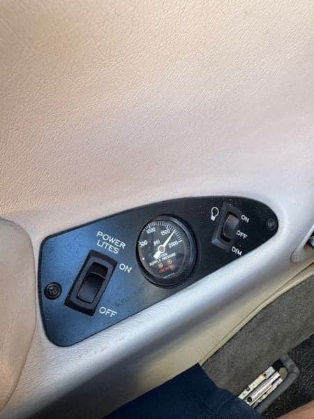 Close-up of the aircraft's power and light controls on the side panel.