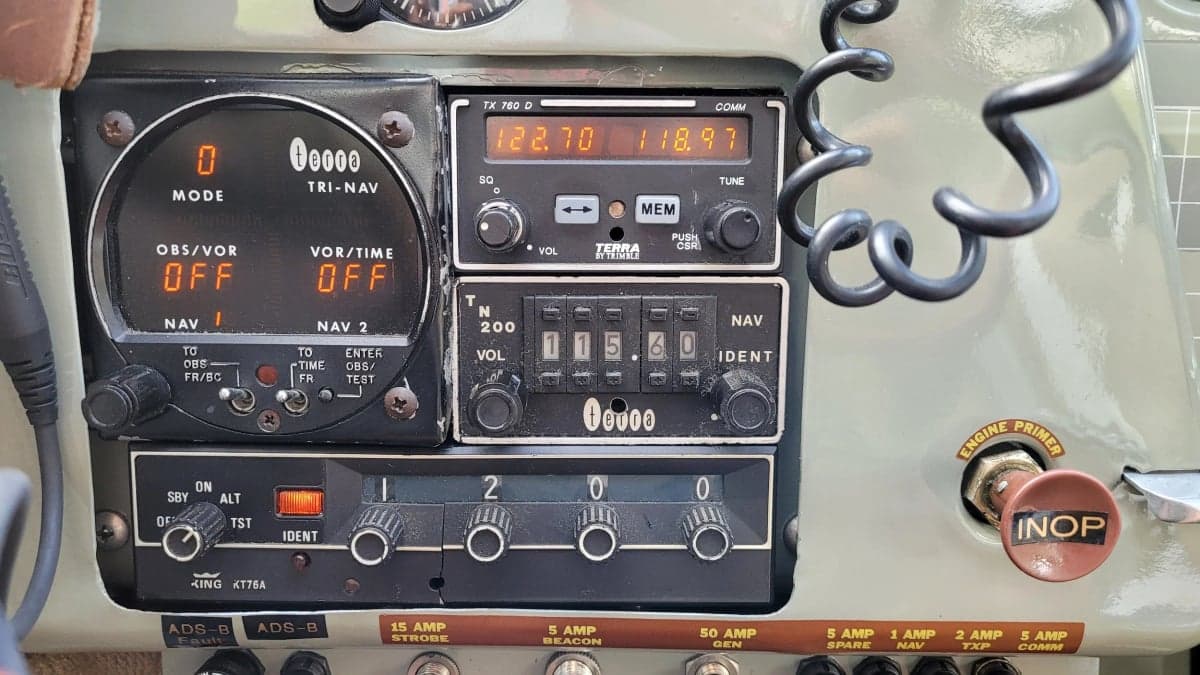 Close-up of the radio stack in the Cessna 170 cockpit.