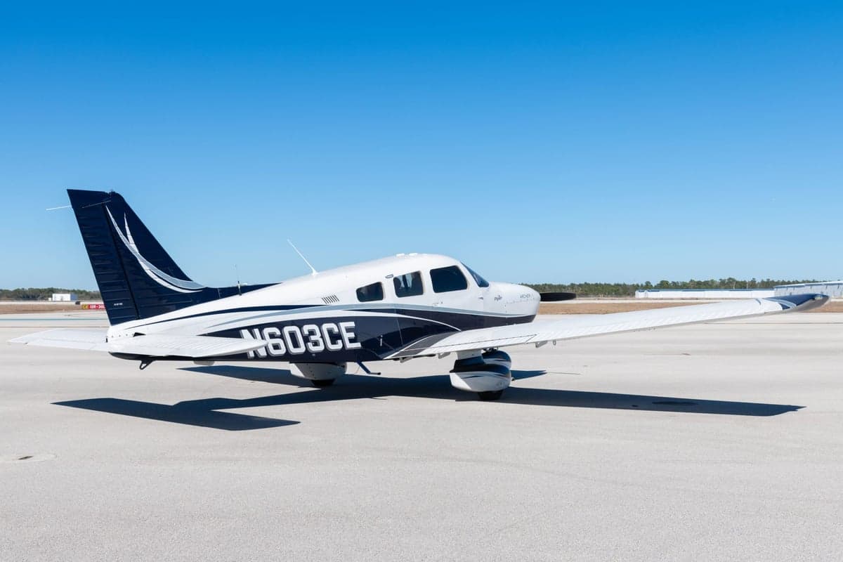 Side view of the Piper Archer LX N603CE on the tarmac.