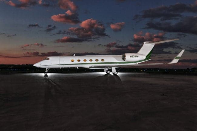 A Gulfstream aircraft with registration N278PH parked on the tarmac at dusk.
