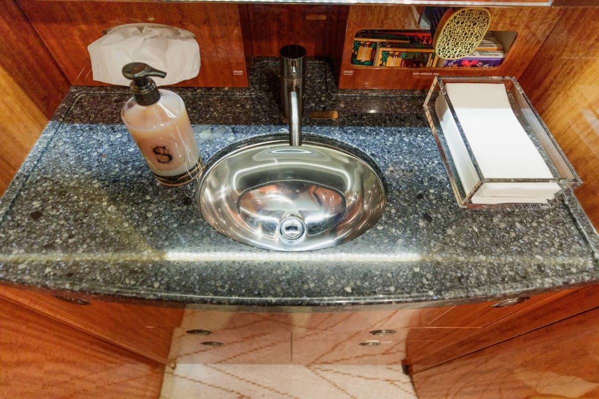A close-up of the sink in the Gulfstream G550 lavatory, showcasing the countertop and fixtures.