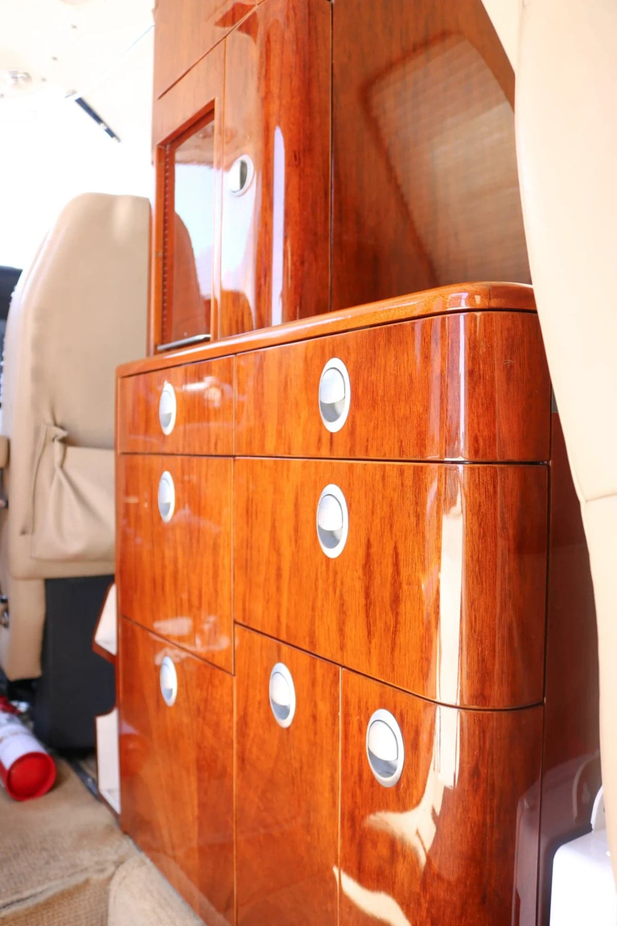 Close-up of a wooden cabinet inside the Citation CJ2 cabin.