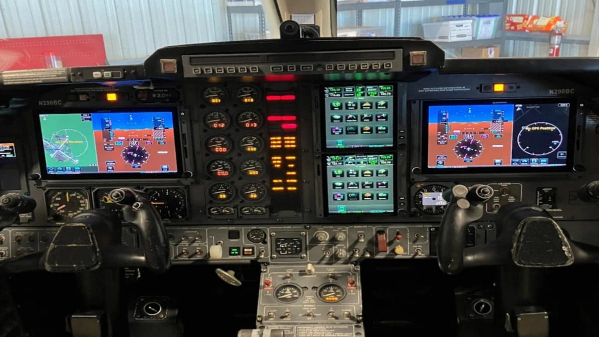 The cockpit features a modern glass panel display.
