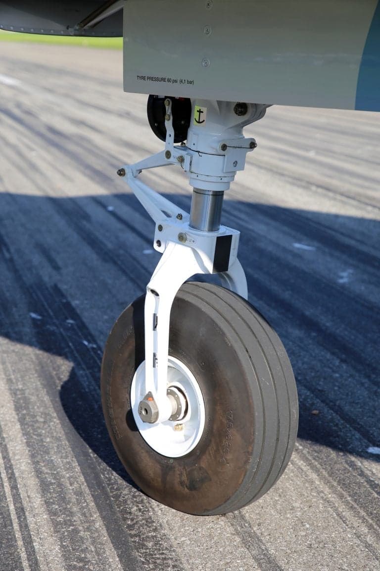 Close-up of the front landing gear of a Pilatus PC-12 NGX.