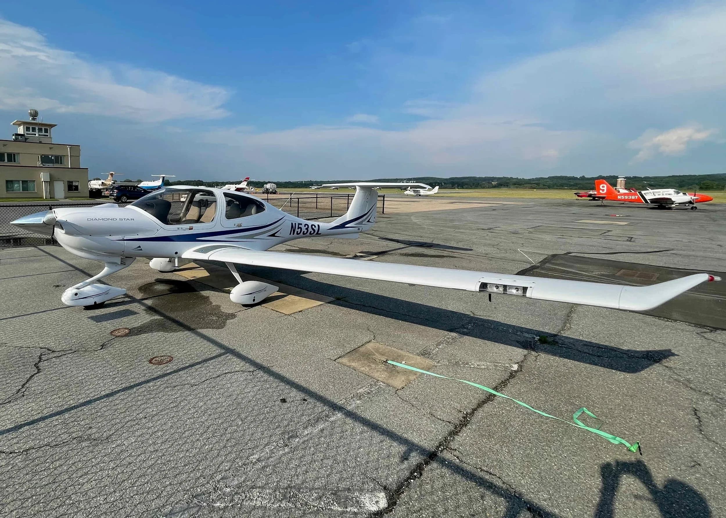 Diamond Star DA40 aircraft N53SL parked on the tarmac.