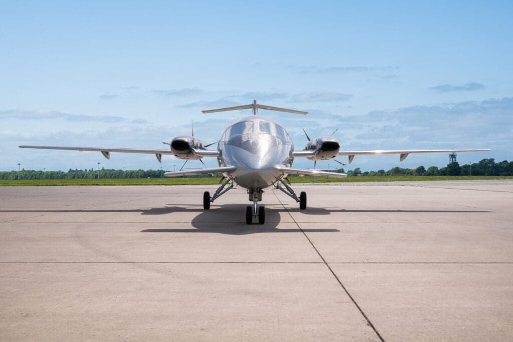Front view of a Piaggio Avanti EVO aircraft on the tarmac.