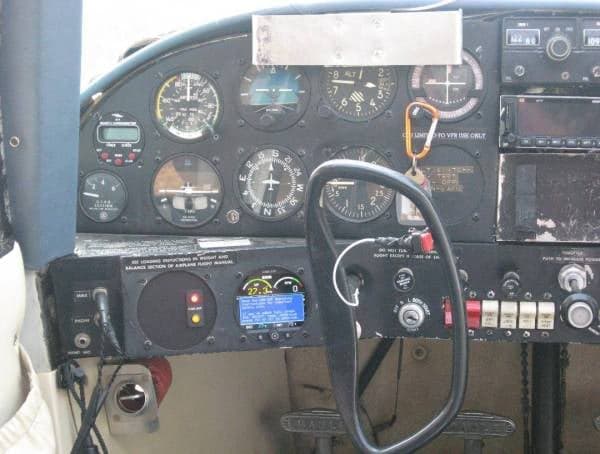 Close-up of the aircraft's instrument panel, showing various gauges and controls.