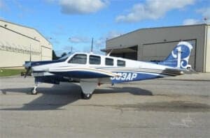 N563AP Bonanza aircraft parked on the tarmac, side view.