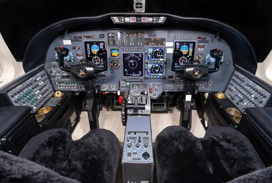 View of the instrument panel and controls in the cockpit of the Cessna Citation Ultra.