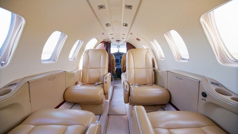 View of the interior cabin with tan leather seats.