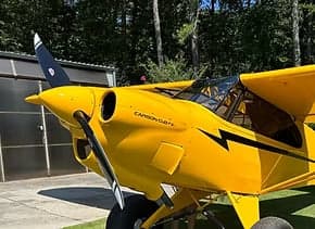 Close up of a yellow Carbon Cub EX aircraft.