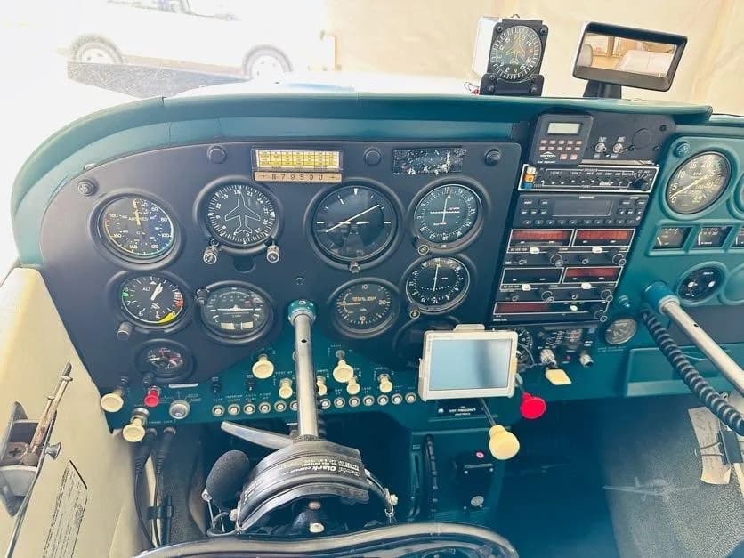 The instrument panel of a Cessna N7959U, featuring various gauges and avionics.