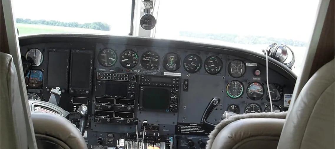View of the aircraft's instrument panel from the cockpit seats.