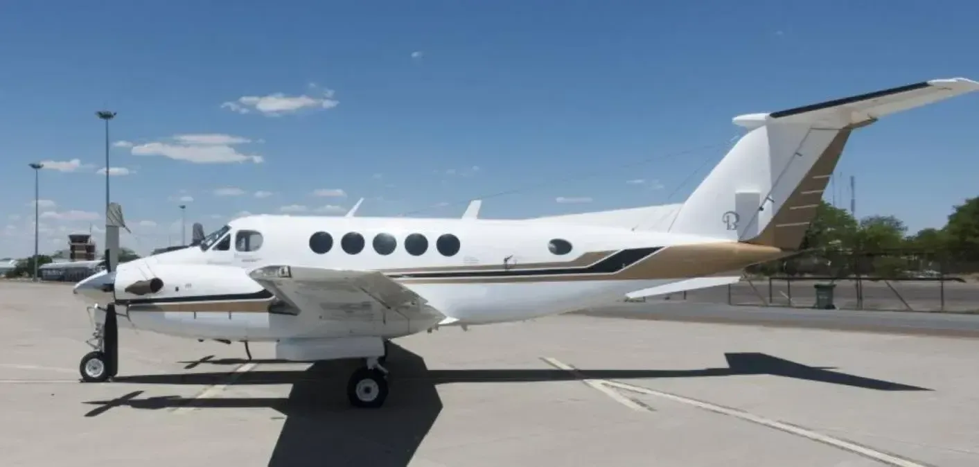 Side view of a King Air aircraft on the tarmac.