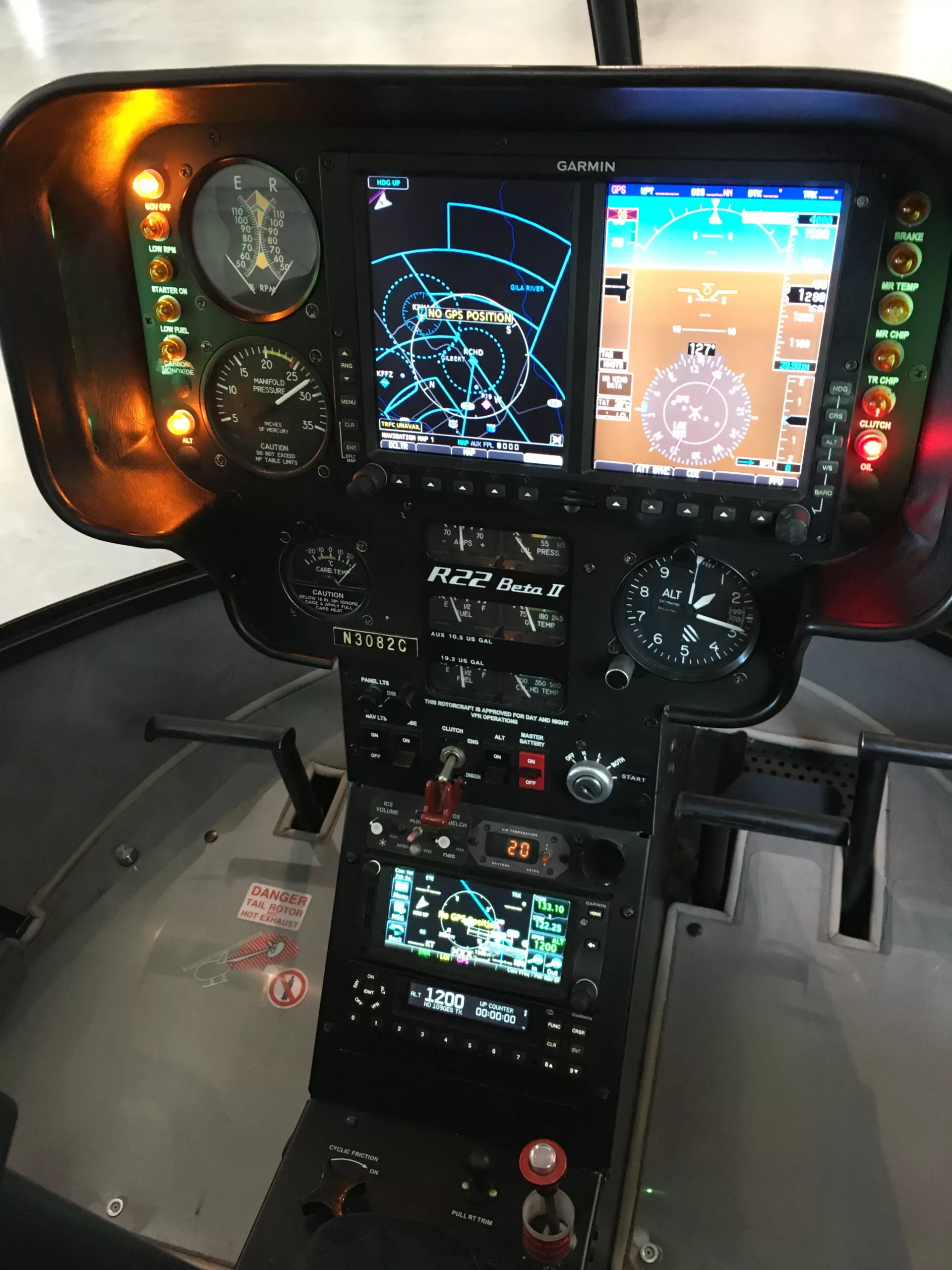 The instrument panel of a Robinson R22 Beta II helicopter with Garmin avionics.
