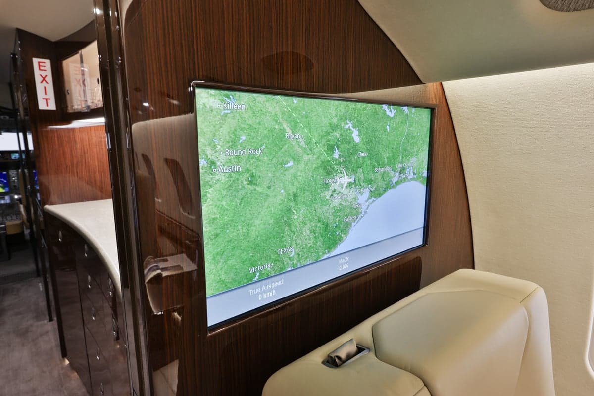Close-up of a monitor displaying a map in the Bombardier Global Express cabin.