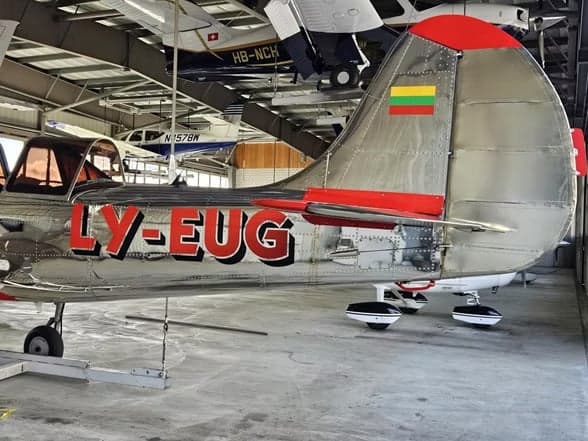 LY-EUG aircraft tail section inside a hangar.