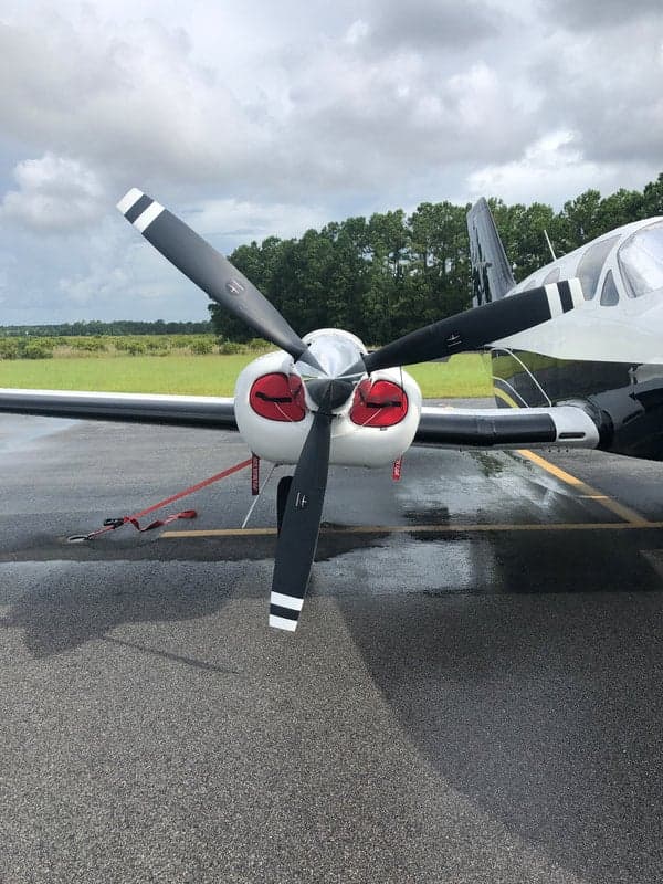 Close-up of the propeller and engine of the N513JN aircraft.
