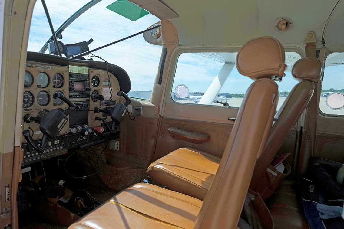View of the cockpit and front seats of the Cessna 206.