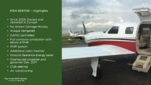 A Piper PA-46-500TP Meridian aircraft with an open door on the tarmac.