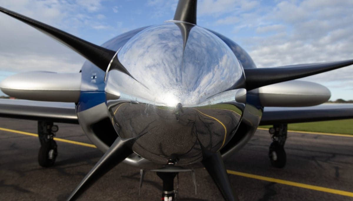 N80FY Piper M600 parked on the tarmac, showing the wing and tail with a blue and silver paint scheme.