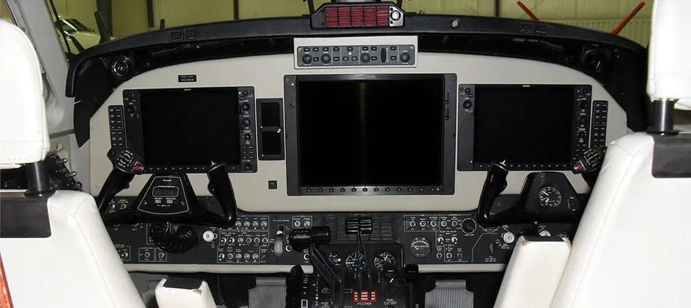 The aircraft's cockpit features a modern glass panel display.