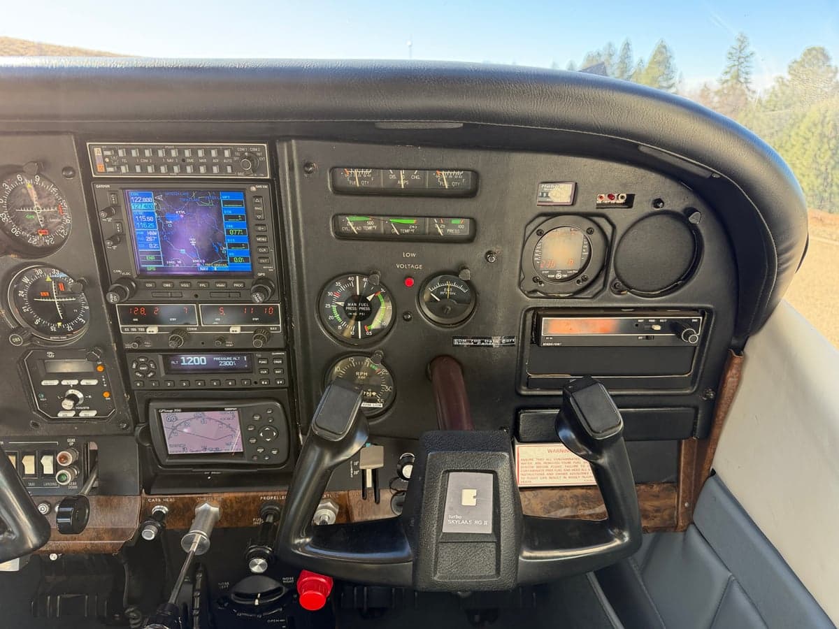 The aircraft's instrument panel features modern avionics and traditional gauges.