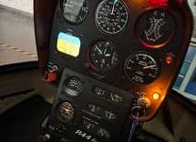 Close-up of the instrument panel in a Robinson R44 helicopter.