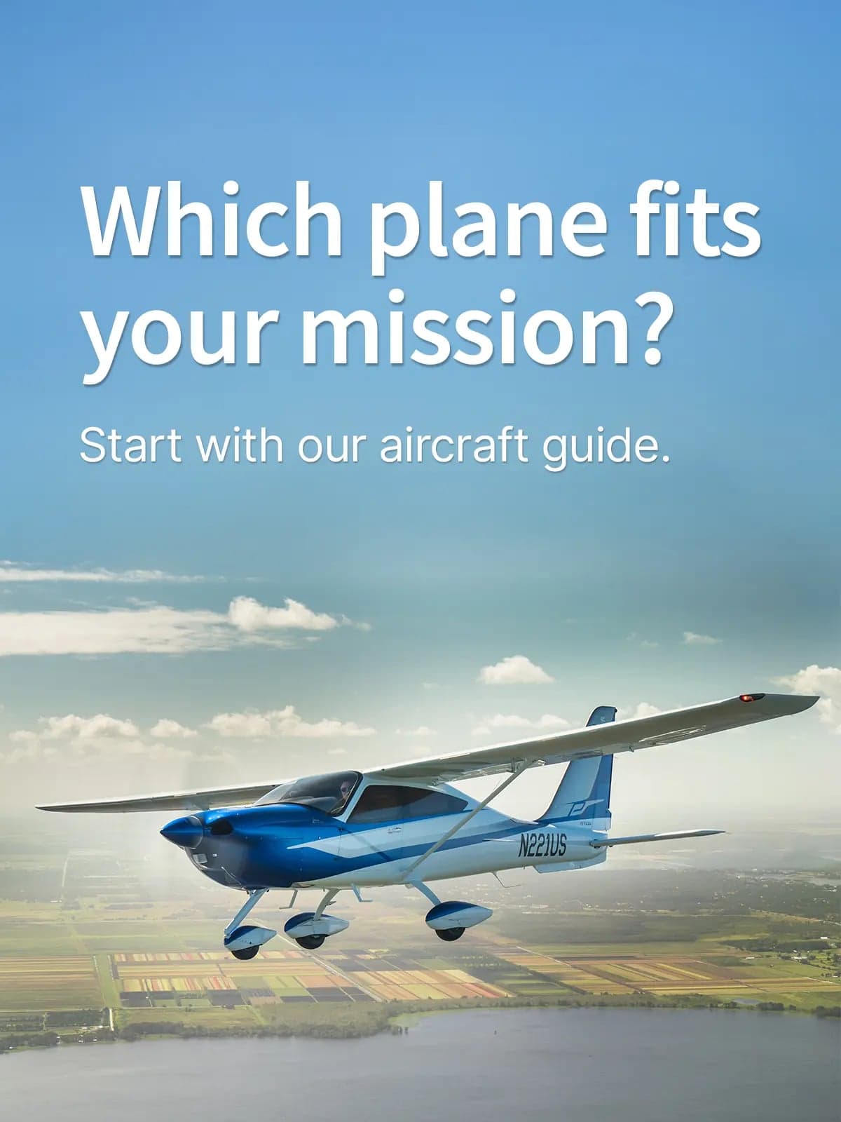 A blue and white Cessna flying over a rural landscape.