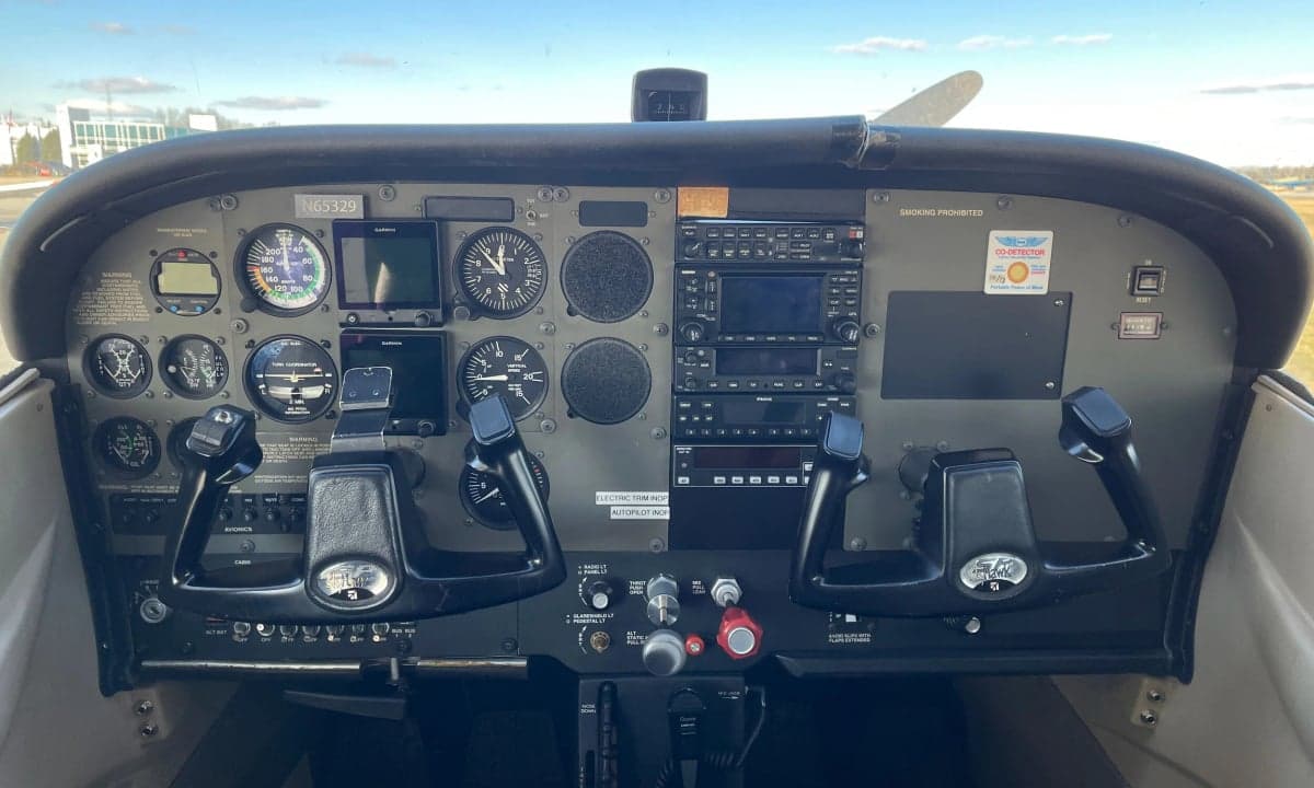 The instrument panel of a Cessna 172 Skyhawk, showing various gauges and controls.