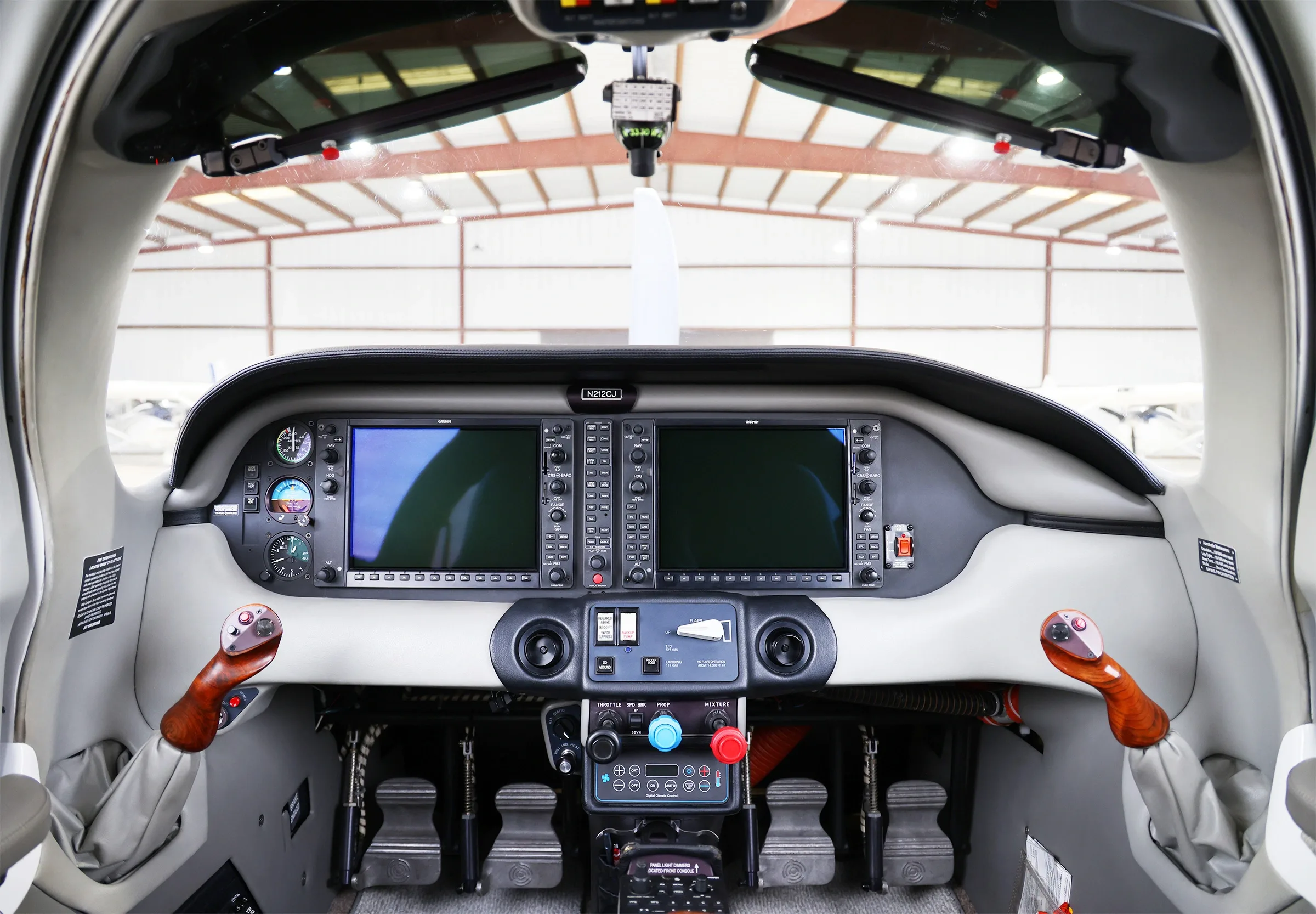 The cockpit of a Cessna TTx aircraft, featuring a modern glass panel display and dual yokes.