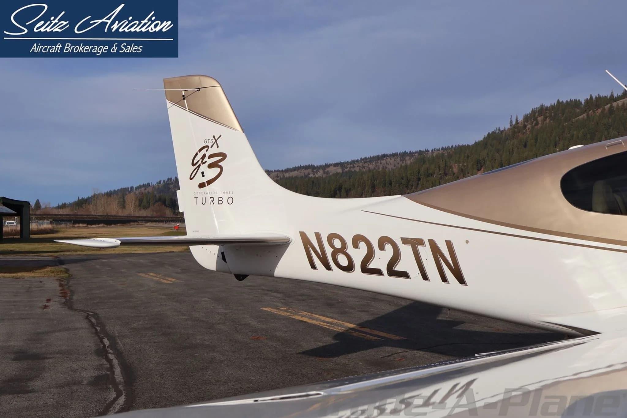 Close-up of the Cirrus SR22T aircraft's tail, showing the "G3 TURBO" logo and N822TN registration.