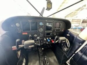 View of the instrument panel and controls in the cockpit of the aircraft.