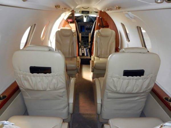 Interior view of the jet cabin looking towards the cockpit.