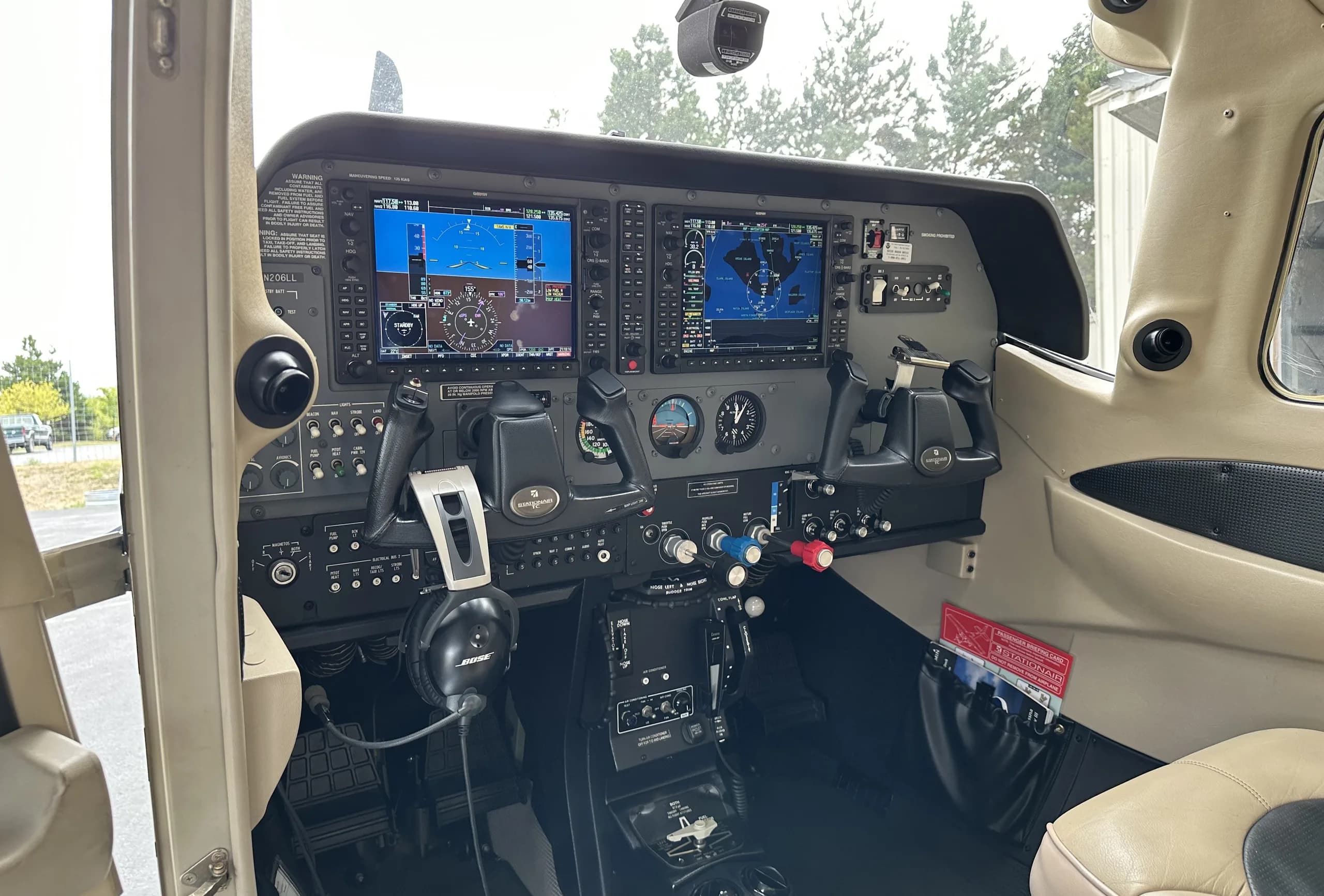 Cockpit view of the Cessna 206 Stationair with modern avionics.
