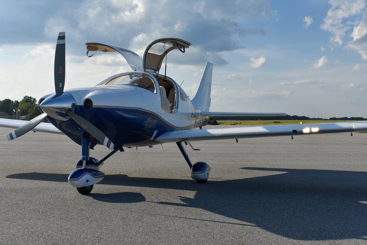Front view of a Lancair Columbia 350 aircraft on the ground.